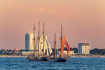 Sailing ships in the sunset at the Hanse Sail in Rostock by Rico Ködder