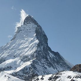 Panoramic view of the majestic Matterhorn summit in front of a small cloud by Besa Art