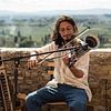 Straatmuzikant in Toscane van Trudy van der Werf