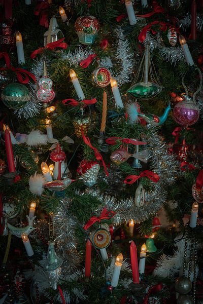 Beautiful antique baubles and candles in a unique crib setting with a homely atmosphere. by Ad Huijben
