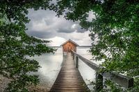 Romantic jetty with boathouse on a lake in Bavaria