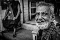 Old wrinkled man smokes a cheroot cigar in the streets of Yangon by Wout Kok thumbnail