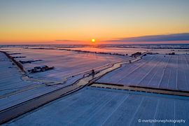 Sunrise in the snow by Martijn de Ruijter