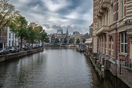 The Amstel River seen from the Aluminium Bridge on Kloveniersburgwal in Amsterdam. by Don Fonzarelli