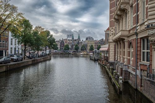 The Amstel River seen from the Aluminium Bridge on Kloveniersburgwal in Amsterdam. by Don Fonzarelli