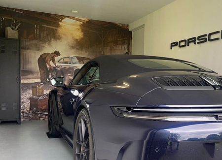 Silver Porsche 911 in Rustic Garage Scene