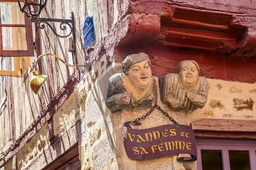 Funny figures on a half-timbered house in the old town centre of Vannes, Brittany