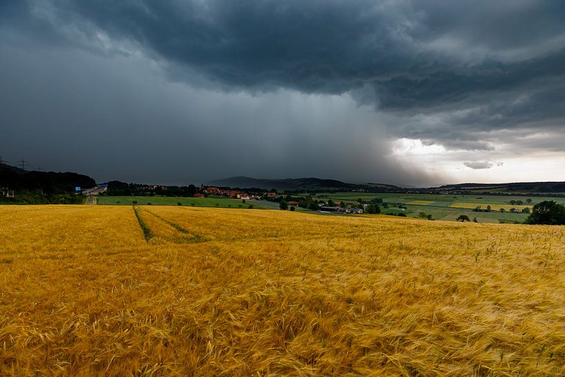 Herleshausen in a summer thunderstorm by Roland Brack
