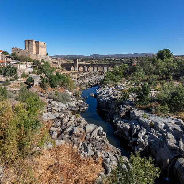 Fortress with bridge and river near Leon in Spain by Joost Adriaanse