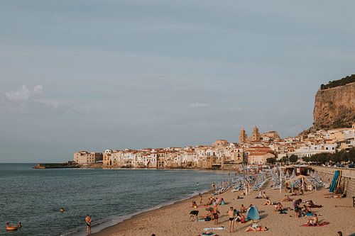 The beach of Cefalu with view on the city, Sicily Italy