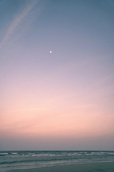 View from the beach on the island of Usedom to the Baltic Sea with the moon in the sky by Martin Köbsch