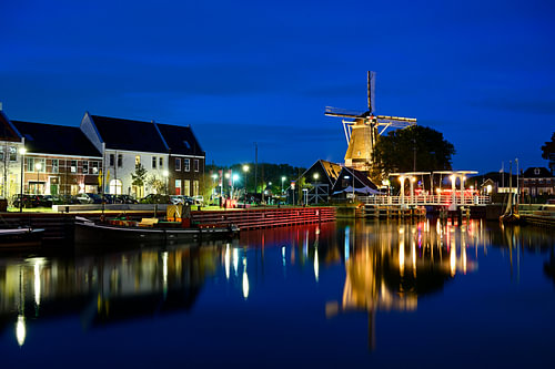Harderwijk harbour with a windmill and a bridge