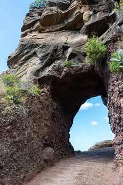 rocks with hole with blue sky view