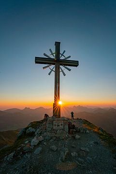 Sunrise over the Tannheim mountains with summit cross by Leo Schindzielorz