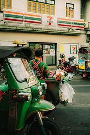 Urban Thailand: colourful streetscape with tuk-tuks and street food