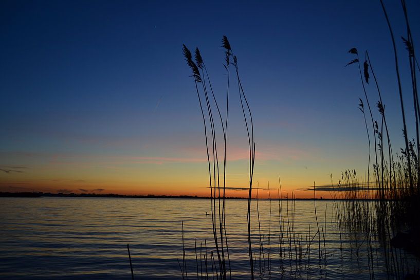 Sunset on the waterfront in Zeewolde by Robinotof
