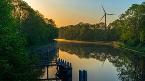Sunrise around the corner over a waterway