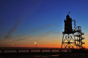 Lighthouse at sunset van Lex Schulte