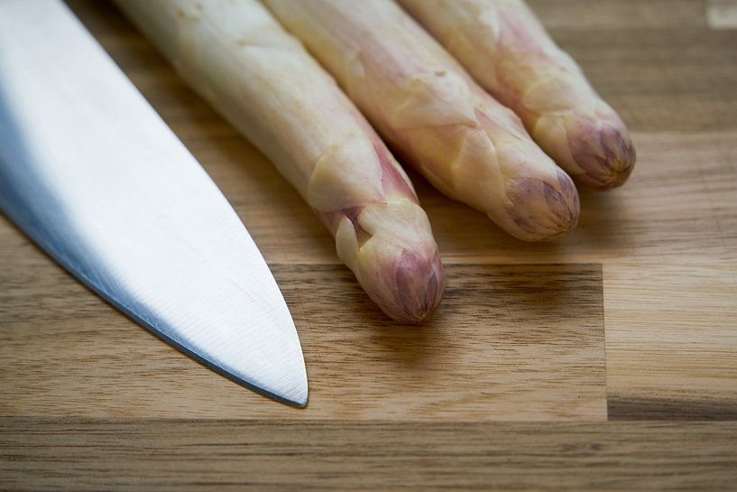 Fresh white asparagus in the kitchen by Heiko Kueverling