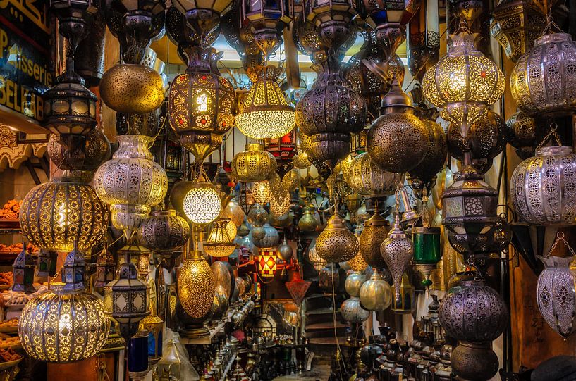 Bazaar with many different oriental lamps in Medina of Marrakech in Morocco by Dieter Walther