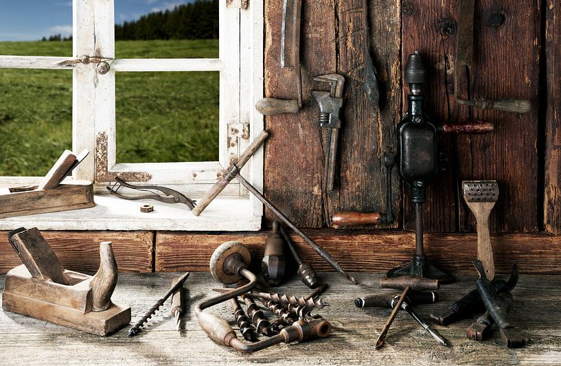 old tools on a workbench by Jürgen Wiesler