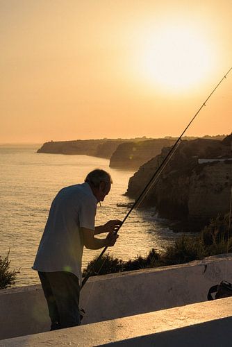 Angler im Sonnenuntergang