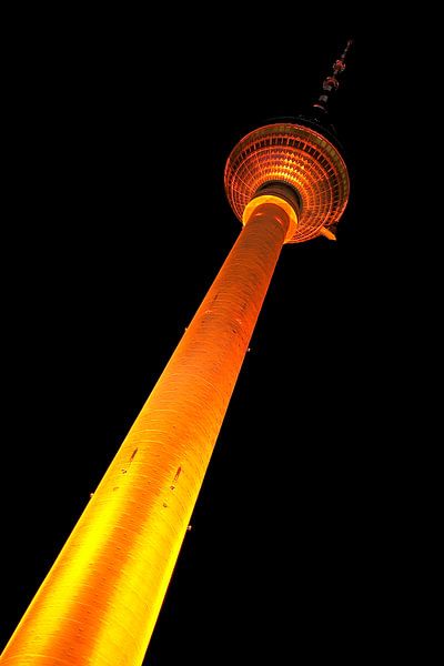 Berlin television tower with yellow illumination by Frank Herrmann