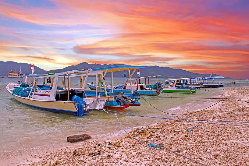 Traditional boats at Gili Meno in Indonesia with sunset by Eye on You