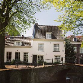 Old house alongside a bridge and canal in Amersfoort, Netherlands by Daniel Chambers