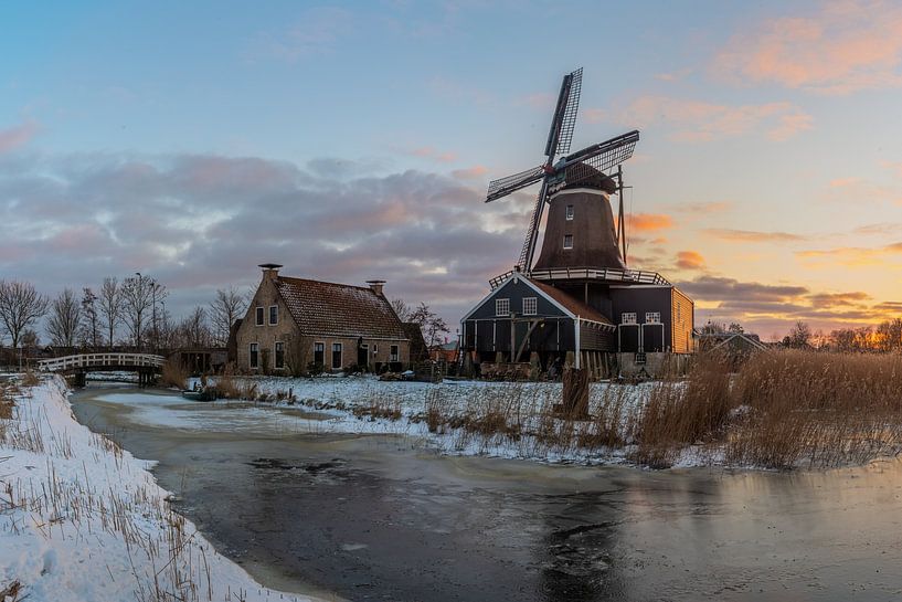Windmill the Rat in Ijlst in wintry conditions by Hillebrand Breuker