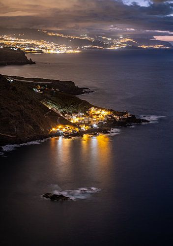 Illuminated coastal villages of tenerife by night