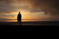 Romantic young couple at sunset on the Wadden Sea