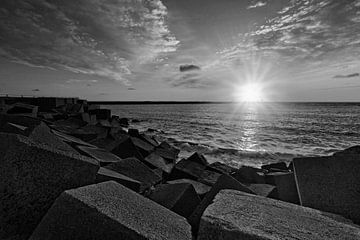 sunset behind the pier head at Scheveningen harbour