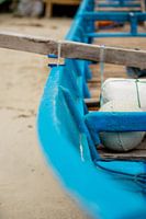 Half blue boat on the beach