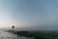 Foggy sunrise at the mill crossing in Aarlanderveen