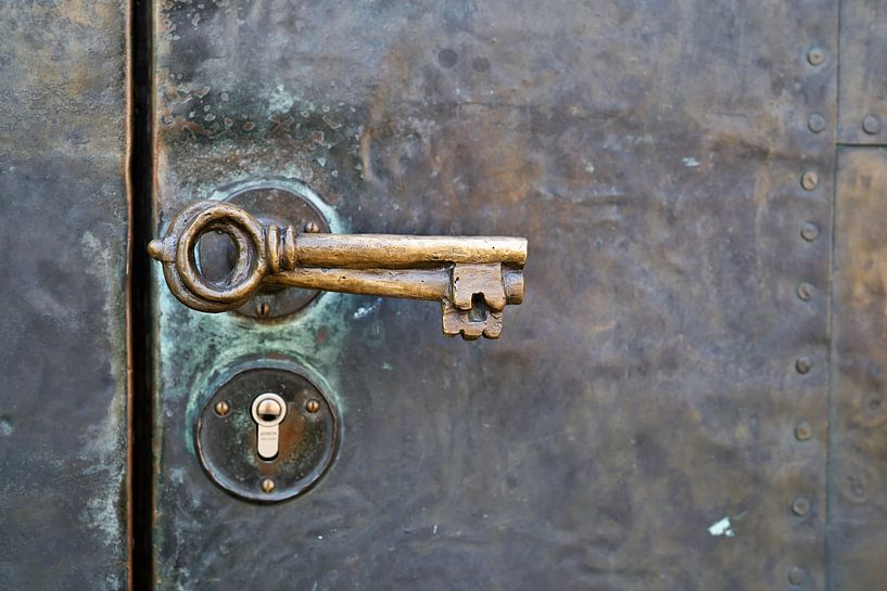 historical door handle on the door of the Petrikirche in Magdeburg by Heiko Kueverling