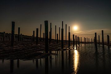 The Palendorp at Petten captured in the middle of the night with a full moon. by Jaap van den Berg