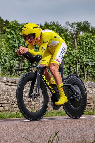 Tadej Pogacar in yellow on time trial bike upright