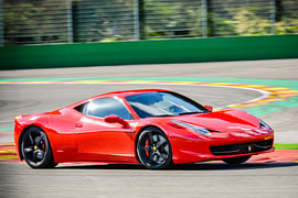 Red Ferrari 458 Italia sports car driving fast by Sjoerd van der Wal Photography