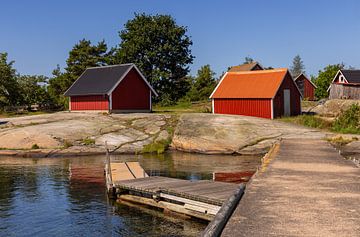 Red boathouses along the Swedish coast