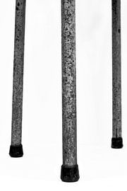 Picture of a detail of a vintage stool in black and white. by Therese Brals