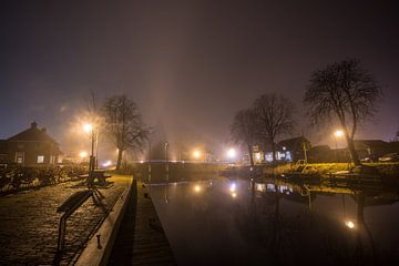 Brug in de mist over kanaal van Maurice Hamming