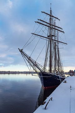 Sailing ship in the city harbour in the Hanseatic city of Rostock in winter