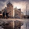 Street life in Amsterdam on the dam during after a winter shower by Jolanda Aalbers