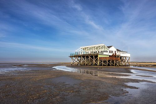 Pile dwellings on the North Sea coast on the beach at St. Peter Ording