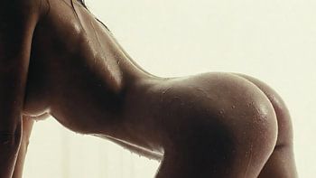 Nude photograph of a naked woman - side view