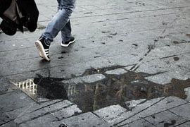 Artistic shot of a puddle with reflections by Maarten Langenhuijsen