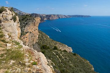Blue Mediterranean Sea and limestone cliffs by Adriana Mueller