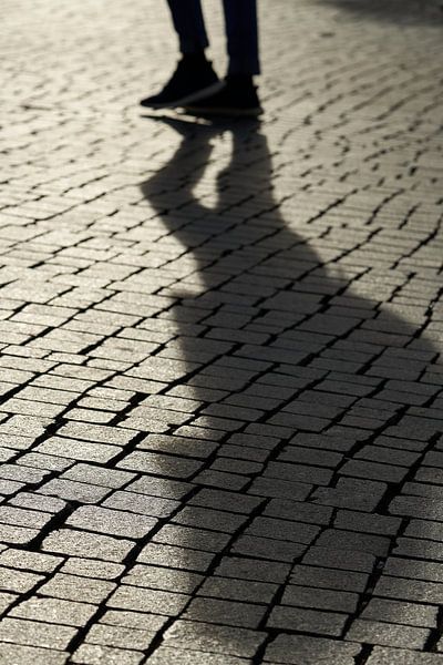Shadow of a pedestrian by Heiko Kueverling