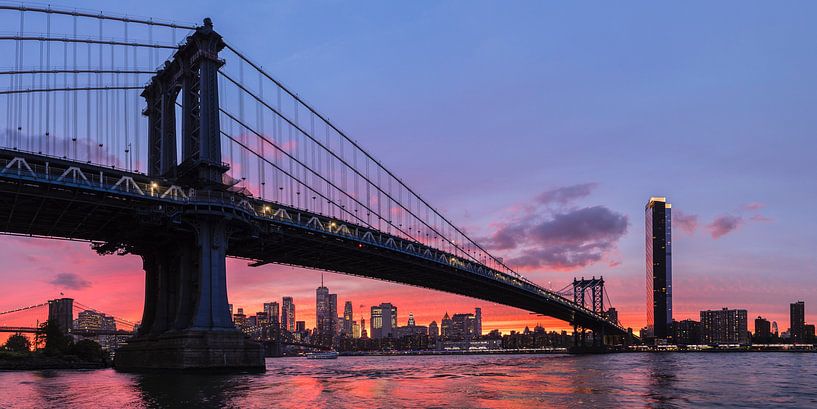 Skyline of Manhattan and Manhattan Bridge at sunset, New York, USA by Markus Lange